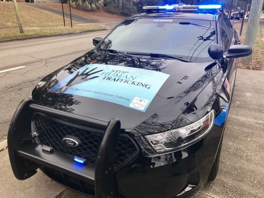 human trafficking awareness police squad car wrap