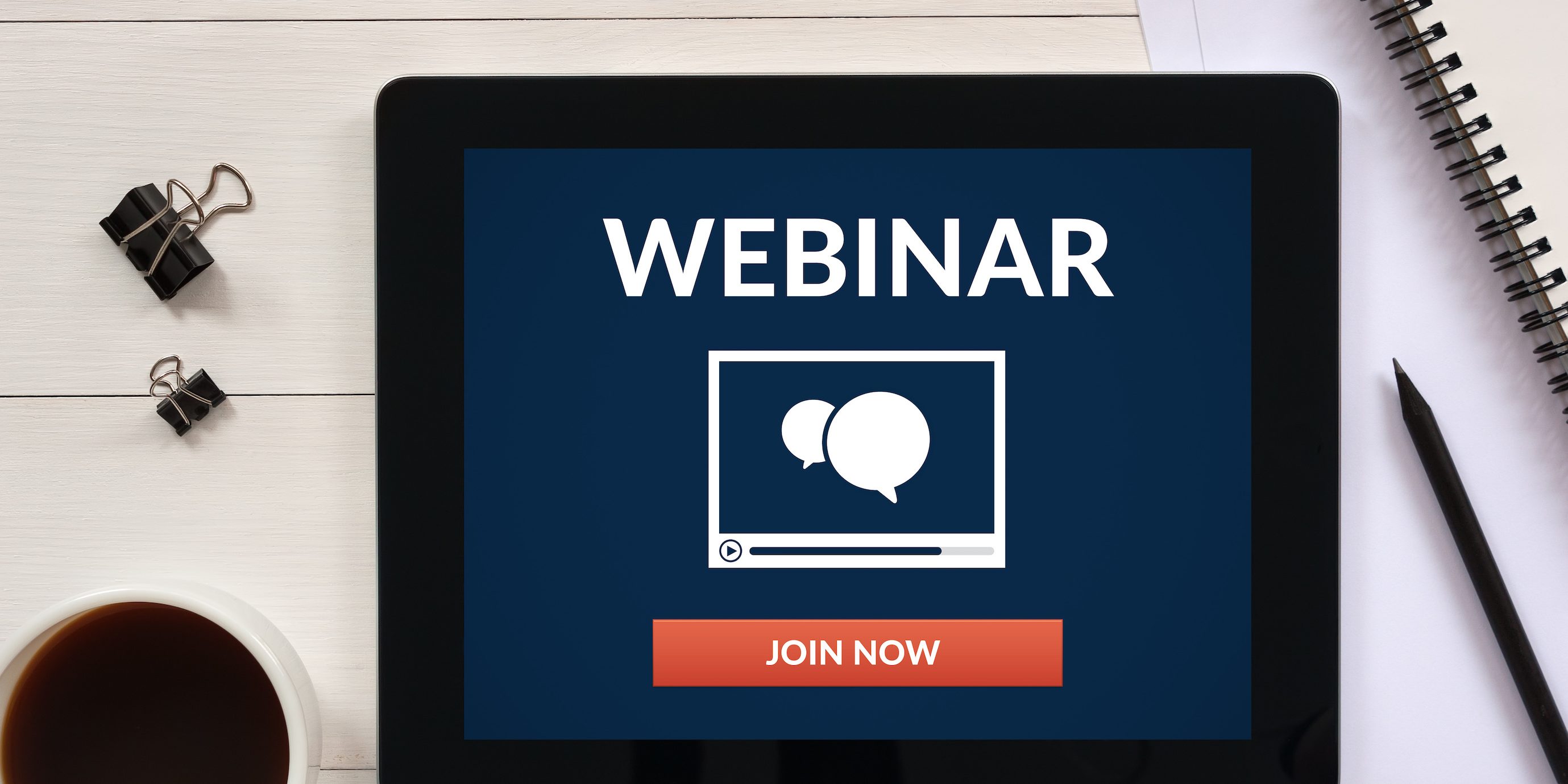 Webinar concept on tablet screen with office objects Webinar